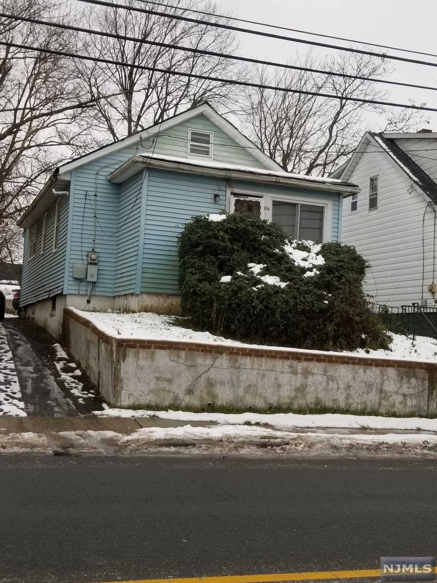 ATTENTION INVESTORS/BUILDERS - HOME NEEDS RENOVATION - PURCHASE INCLUDES PLANS FOR ADDING A 2ND LEVEL TO THE HOME