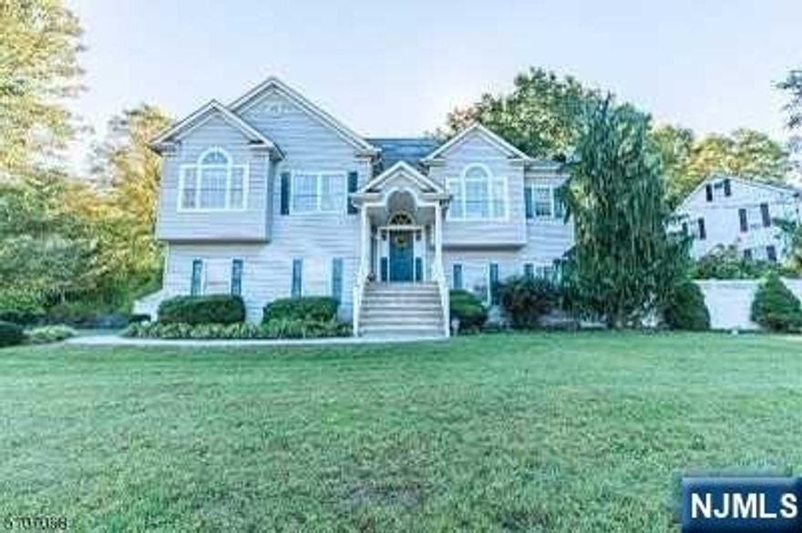 Move in ready custom home ready for immediate occupancy. Home boasts gorgeous Living Room with vaulted ceiling and fireplace, modern eat-in kitchen with sliders to deck, formal dining room with Hardwood floors. 4 very large bedrooms and 3 full modern baths. Walkout ground level basement with dry bar has full bath and can be used as an in law suite. Gorgeous flat and fenced in yard. Abundant storage and a spacious 3 car garage.