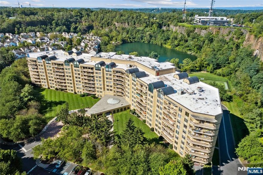 Looking for a spacious condo with one-floor living? Welcome to 409 Smith Manor Blvd, a 2-bedroom (currently used as an office), 1 1/2-bath home with sweeping views of the Cliffs and Lake. This unit offers custom built-ins and closets throughout, plus the convenience of in-unit laundry and two-car garage parking. A double-sized storage unit is also included. While the condo offers great space and features, it is ready for your updates and personal touch to make it truly your own. Crown View Manor provides resort-style amenities including valet parking, 24-hour concierge, pool, gym, game and party rooms, tennis, putting green, and a scenic walking trail around the lake. Recent building upgrades include a new generator and a beautifully renovated lobby. Perfectly located just 15 miles from Midtown Manhattan, with the West Orange Jitney pickup right at the front entrance for easy access to train stations. Estimated 2025 taxes: $9,784.26 (buyer to verify with Tax Assessor). Special assessment: $387.12/month through December 2025. Showings begin on 9/6/25. Condo is being sold in "As Is" condition.