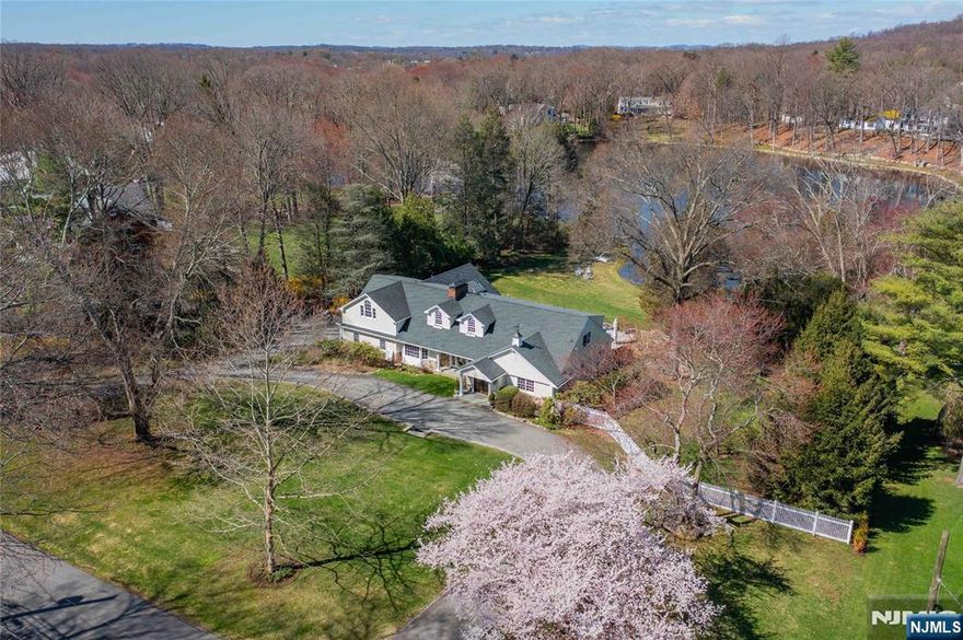 Retreat to your private paradise in this completely renovated lakefront property in beautiful Shadow Lake Estates. A hidden gem offering mesmerizing water views and incomparable sunsets, this sanctuary provides a front seat to nature, with each season ushering in a new wonder to behold. This 5-bedroom, 5-1/2 bath residence sits on over two acres and includes approximately 300 feet of shoreline for easy access to enjoyment on the water. The open floor plan seamlessly merges indoor and outdoor spaces, and includes a chefâ€™s kitchen with top of the line appliances, a large great room with soaring ceilings, three fireplaces as well as a music room. A walkout lower level with a rec room and wine cellar, a service kitchen for outdoor entertaining, and a spa bathroom with steam shower and sauna adjacent to the exercise room adds a third level of living. The heated pool with sun shelf adds to the vacation feel of this home. An organic vegetable garden and a terraced herb garden adjacent to the spacious kitchen rounds out this offering. While only 30 min. to Manhattan, you will feel worlds away. This residence is part of Shadow Lake Estates, an enclave of special properties with membership only access to a lakefront clubhouse, tennis and pickleball, boating, fishing and swimming.