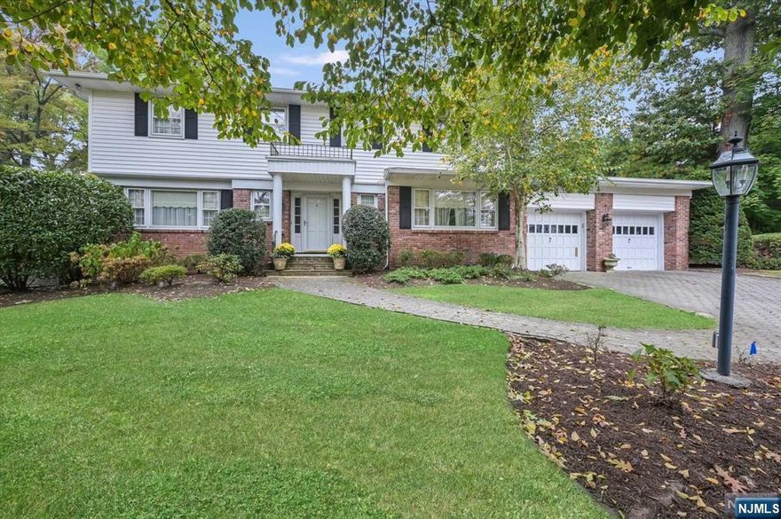 Presenting 8 Egan Place, an impressive C/H colonial in the coveted North Cliffs! An elegant entrance leads to the living room w/fpl, FDR, powder room, den w/fpl that opens to the updated kitchen w/stone countertops/backsplash, sub zero fridge, skylight and sgd to the patio and pool. A bright family room or fifth bedroom, boasting floor to ceiling windows, skylight and newly renovated bath w/steam shower and laundry complete the first floor. Second floor features three beautifully appointed bedrooms, full bath w/a steam unit and primary suite w/sgd to the balcony that overlooks the private property. A newly finished basement offers a bar, family room, gym area & half bath. Relax and entertain in the private resort-like yard featuring a heated i/g pool surrounded by a paver patio w/a retractable awning. Amenities include a whole house generator, security and sprinklers. An exceptional home minutes to the GWB, fine dining, parks, tennis and a short walk to North Cliffs School