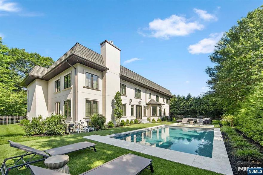 Built in 2017 by Fermano Builders, this nearly 8,000 square foot masterpiece (including finished basement and 3-car garage) showcases timeless craftsmanship and modern comfort. Quarter-sawn hardwood floors with radiant heat run throughout. A soaring double-height great room anchors the home, complemented by a custom office and chefâ€™s kitchen by St. Marten with quartz countertops, Wolf range and Sub-Zero fridge. The primary suite offers 2 walk-in closets, spa bath with Jacuzzi and glass shower. Upstairs includes 2 ensuite bedrooms plus 2 with a shared bath, all with tray ceilings and 2nd floor laundry. Finished lower level with gym, theatre, rec room, bedroom and full bathroom. Outside, the fenced yard features a heated gunite saltwater pool with auto cover, cleaning robot and WiFi controls. Chateau-style roof, quiet street near Memorial Field. The virtual tour features a comprehensive video tour, 3D model, & floor plans. https://www.njproper.com/mls-199-whitman