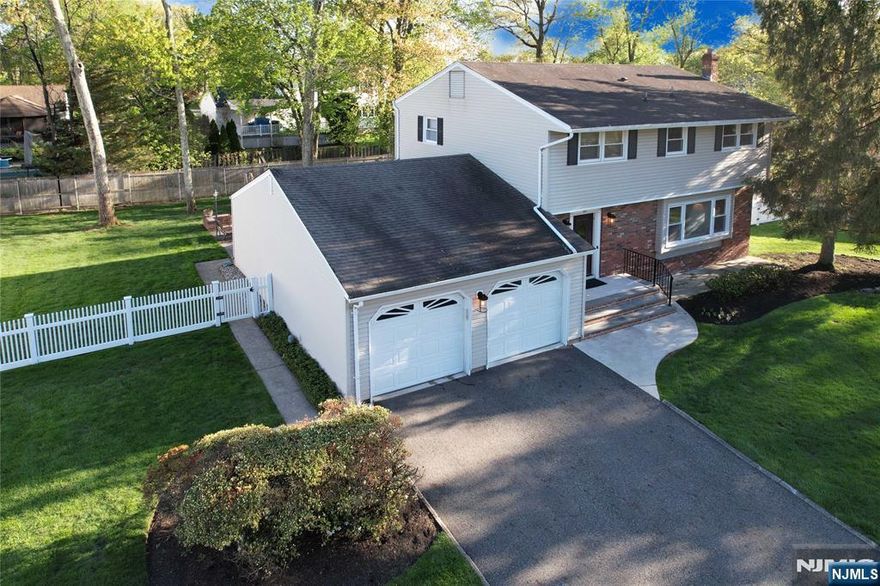 Prepare to fall in love with this gorgeous Colonial style home. The heart of the home has a spacious eat-in kitchen featuring sleek stainless steel appliances. For cozy evenings or lively hosting, the family room has a sliding door that leads out onto a huge patio and park-like, fenced-in yard. Retreat to the primary suite, a true haven featuring a private ensuite and a generous walk-in closet. Hardwood flooring throughout majority of home. With a large basement waiting for your personal touch, this is a move-in-ready gem that you are going to want to see today!