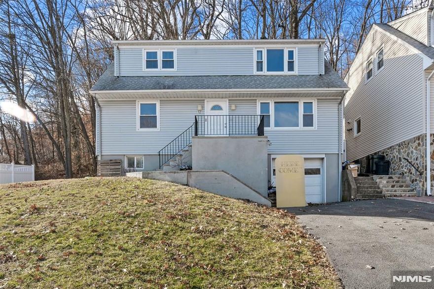 Great investment property or an opportunity to live in one unit and rent out the other. Gorgeous view of the skyline. This multi-family property has 2 units - each unit has 2 bedrooms and 1 bathroom totaling 4 bedrooms and 2 full bathrooms for the property. There is an unfinished basement with a washer & dryer, 2 boilers, 2 hot water heaters, 2 electric meters and 2 gas meters. There is a garage as well as storage available. Driveway has been redone and parks 3-4 cars, the interior has been freshly painted, vinyl replacement windows including basement and the backyard features a treks deck & firepit. Unit 2 on the top floor had its kitchen cabinets painted and has hardwood floors in the bedrooms and living room. Unit 1 on the bottom floor has new vinyl flooring and hardwood floors in the bedrooms and living room. Sold STRICTLY AS-IS. Square footage is from State Info Service.