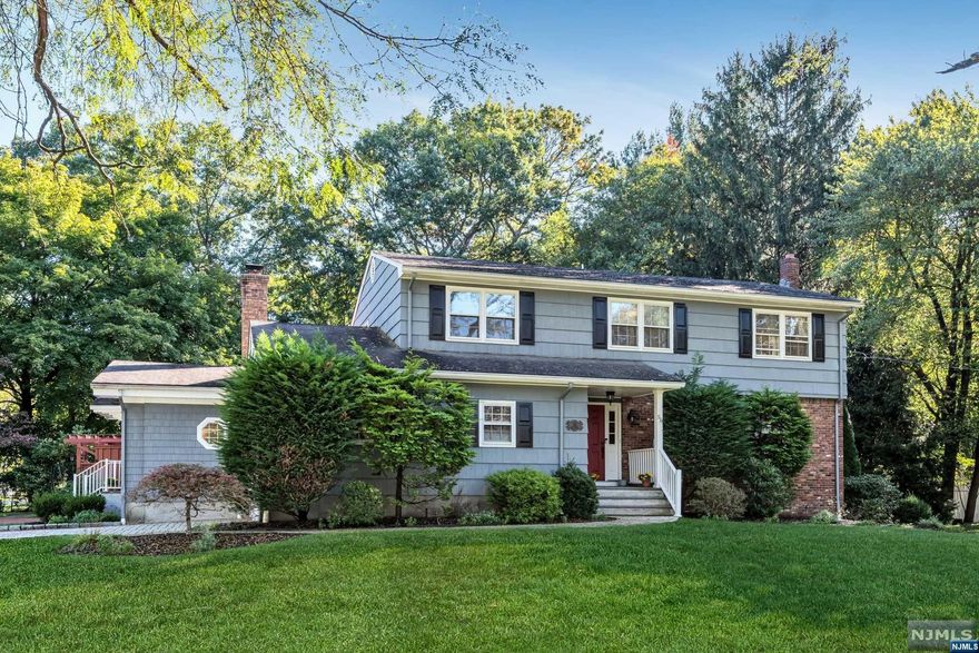 Looking for space to spread out? How about to entertain? This home has it all! A wonderfully expanded colonial, it offers a spacious floor plan and more than a half-acre of private yard with an inground pool and oversize deck. In a perfect blend of traditional architecture and modern amenities, this home brings you many perks, such as an open flow on the first floor, brand new white kitchen with quartz counters and stainless-steel appliances, spacious family room with gas fireplace and reading nook, convenient first floor laundry room, three newly renovated full baths, primary suite with walk-in closet, fabulous lower-level recreation spaces, hardwood floors, and a freshly painted neutral interior. Enjoy this beautiful tree-lined neighborhood close to school, shopping, and commuter transportation. One you won't want to miss!