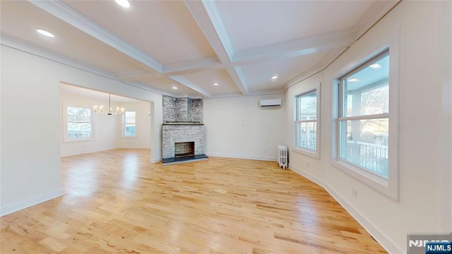 Beautifully renovated Colonial-style single-family residence offering modern design, clean lines, and updated finishes throughout. The home features new hardwood floors, a newly updated kitchen and bathrooms, brand-new electrical, and updated plumbing, including a new copper main water service line.The first floor includes a living room, dining room, kitchen, and powder room, and is heated by radiators with supplemental mini-split systems that also provide cooling. The second level offers a primary bedroom with a walk-in closet, two additional bedrooms, and a Jack-and-Jill full bathroom with direct access from the primary bedroom. The third level features an additional bedroom with a walk-in closet. The second and third floors are heated by forced hot air and cooled by central air conditioning.The finished basement includes large rec room, laundry hookups, and a full bathroom, providing additional usable living space. Exterior upgrades include new siding, new windows, and a new roof, along with a rear deck and a spacious backyard, completing this move-in-ready home with a modern look and feel.