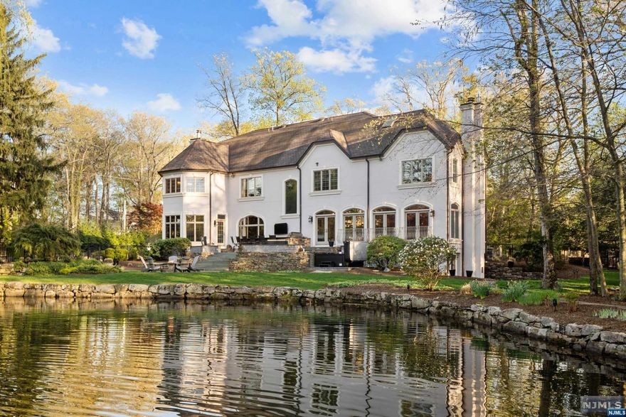 You're not just buying a home, you're buying a LIFESTYLE! Renovated 9,500 sqft of finished living space on nearly 1 acre of waterfront property along the privacy of the Cove. Featuring 5 beds/8 baths/3 car garage/walk-out finished bsmt w/full bar & wine cellar/basketball court/dock/fire pit/hot tub/two outdoor kitchens. Absolutely stunning gourmet chef's EIK w/ center island/Wolf/Sub-zero/breakfast nook/pantry. Over-sized primary suite with two full baths, one spa-like bath completely renovated over-looking Pines Lake! Unheard of bonus side lot for Pines Lake with basketball court and play area. The minute you walk in the 2-story foyer, you will instantly be mesmerized by the view and serenity of this one-of-a-kind waterfront home! A private hidden gem just 28 miles outside NYC!