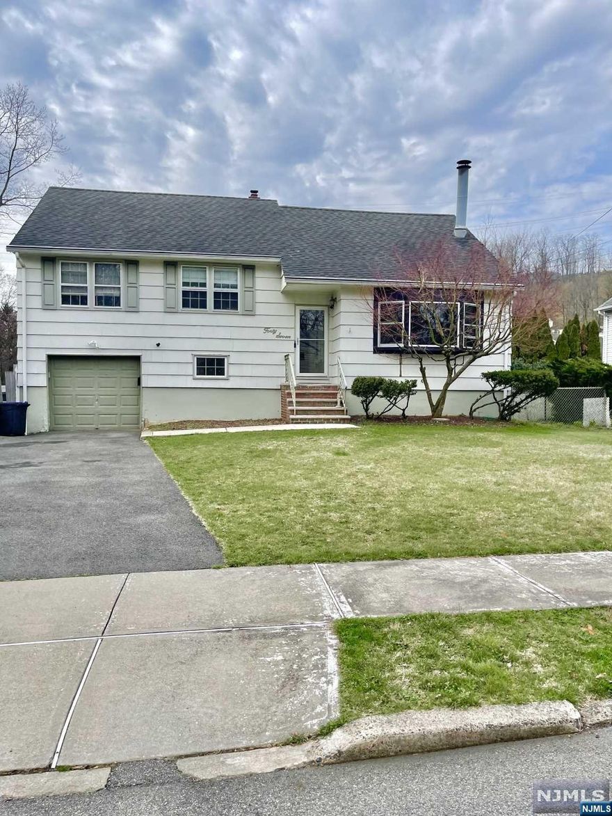 SEARCH NO MORE! This extremely unique one family home is located in a desirable quiet area in Clifton close to Montclair. Upon entry LR W/ Fireplace and Bay-window allowing lots of sunlight. Dinning room, Kitchen .Hardwood floors throughout the home. All year around sun room with sliding doors to rear 8x6 Elevated private deck. A 10x12 patio and a 16x32 in-ground pool. Perfect for the hot summer weather coming in. Upstairs landing access to 3 BR's and 1FB. A couple of steps up further big bedroom #4. In addition a tall Partially finished attic perfect extra space. lastly, split level basement Finished space w/access to attached garage and a FB. In the lower level additional open space for entertainment, movie room, game room. In addition 2 more rooms currently used as the laundry room and the other as an office space. Home is in need of TLC and updates but with the right vision this home can be your dream home. Tons of space lots of potential. Strictly "AS IS SALE"