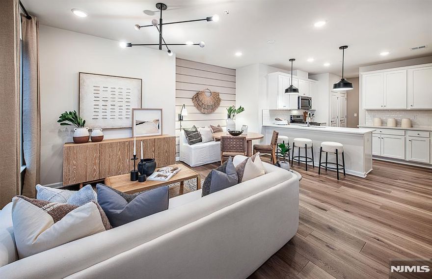 Discover a vibrant blend of comfort, convenience, and connection at Bridgeview - a stunning new construction townhome community in commuter-friendly Kearny, NJ. Perfectly positioned for effortless travel, Bridgeview offers quick access to major highways, the PATH train to NYC, and Newark Liberty Airport - making it an ideal home base for busy professionals and frequent travelers alike. This beautifully designed Bowery townhome features 2 spacious bedrooms, 2 full bathrooms, and is thoughtfully set away from the main road, offering a peaceful retreat with added privacy. Inside, you'll find open-concept living areas, sleek modern finishes, and low-maintenance design - creating a space that's both stylish and functional. Step outside your door and enjoy resort-style amenities, including a sparkling pool, fitness center, elegant club room, co-working lounges, outdoor grilling areas, dog runs, and a shuttle to the PATH station. Plus, you're just a short stroll from everyday essentials and local favorites like Starbucks, LA Fitness, ShopRite, Target, BJs, and a variety of dining and entertainment options. Whether you're seeking elevated living, unbeatable convenience, or the perfect commuter location - the townhomes at Bridgeview check every box.