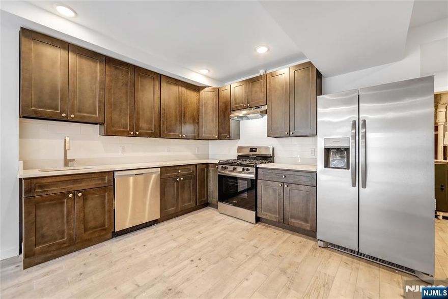 Completely Gut-Renovated Rental Apartment in the Heart of Union City! Welcome to 516 25th St - Unit 1, a spacious & stylish apartment offering 3 bedrooms, 2 full bathrooms, with parking included! This stunning apartment boasts modern features & high-end finishes, including a gorgeous brand new kitchen with quality cabinetry, SS appliances, quartz countertops, & a crisp white backsplash. The large living / dining area provides ample space for relaxation and entertaining. Each generously sized bedroom offers great closet space. The unit includes a washer & dryer connection for added convenience. (tenant to provide W/D) The two beautifully designed bathrooms feature stylish tilework and sleek vanities. Don't miss out on this fantastic rental! EVERYTHING IS BRAND NEW. Just steps from NYC transportation and within walking distance of shopping, restaurants, cafes, and more. Credit check & proof of income required. A small pet may be considered. Tenant responsible for all utilities.