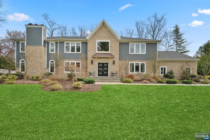 PRICE IMPROVEMENT! Indulge in luxurious living offered by this exceptional home w/Top-of-the-Line features & unparalleled comfort, completely renovated within the last 5 years. Step into the grand 2-story EF & be greeted by the custom-built office, elegant DR & Chef's KIT equipped w/High-End APPL. The 2 story GR offers a cozy fplc & custom-built bar w/lighted shelves, perfect for entertaining guests. A 1st floor BR w/En-suite BA & a renovated PR are also included. Upstairs, the lavish primary suite fts a tray ceiling, 2 oversized WIC & gas fplc, accompanied by the primary bath w/2 vanities, soaking tub & LRG shower. 3 ADDL BRs, media room/office & renovated bath completes the 2nd level. The LL offers a gym, rec/play area, full bath & 2nd KIT for added convenience. The BKYD is a tranquil oasis w/lush landscaping, paver patio, built-in Lynx BBQ & a flat grassed BKYD. Other amenities include skylights, Lutron lighting, sound & security systems, laundry room & 3-car garage.