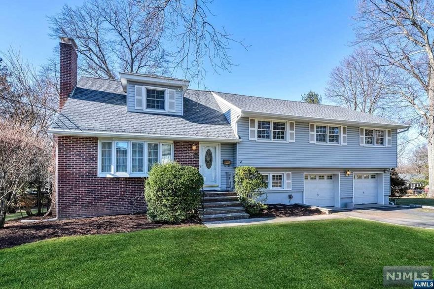 This expanded split-level home is located on a quiet cul-de-sac in the heart of Midland Park. The home boasts 6 bedrooms with 2.5 baths. The first floor features a living room with a fireplace, a dining room with a slider opening to the deck and an eat-in kitchen. The second floor houses 3 bedrooms and a full bath, as well as a Primary bedroom with a walk-in closet, dressing area and a full bath with a stall shower. The 3rd floor provides a versatile space serving as the 5th bedroom. The ground floor features the 6th bedroom, laundry room/ half bath, storage and access to the 2-car garage. The basement is partially finished with a utility/storage room. The large backyard lends itself to endless possibilities. Additional features include central air, new roof and so much more. Conveniently located near parks, schools, and transportation to NYC, this home offers the perfect blend of space, comfort, and convenience.