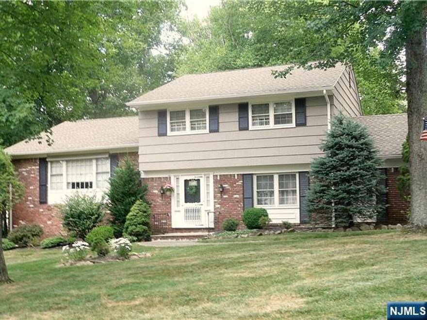 Lovely meticulous well kept home located on one of the most desirable streets in West Caldwell. Enter the home through an inviting foyer leading to a ground level family room with wood burning fireplace with a beautiful view of the backyard. There is a powder room and office near the family room. Nearby is an entrance to an oversized garage. The 1st floor offers a spacious formal living room leading into a large dining room. The sunny eat-in-kitchen includes stainless steel appliances with ample room for cooking meals. Upstairs there are three bedrooms, two full bathrooms. Pull down stairs lead to an attic with plenty of storage. The basement includes a recreation room/bedroom/office and a large laundry/utility room with plenty of storage. An impressive slate patio leads to a secluded parklike yard perfect for relaxing. This home also offers hardwood floors, two zone heating and cooling system. This home is centrally located near highways and NY trans.