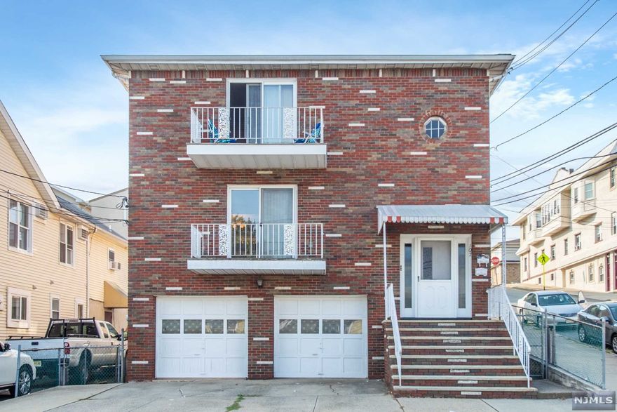 Top/Bottom- Two family: 3 Bedrooms, Living room, Dining room, Eat in Kitchen & 2 full Baths on 1st floor. 3 Bedrooms, LR, DR, Eat in Kitchen & 1.5 Bath on 2nd floor. Ground floor includes Guest Room/rec, Living Room, Summer Kitchen , Full Bath. 2 Car Garage.