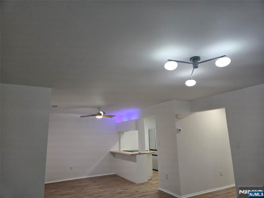 Welcome to this fully updated, bright unit featuring top-quality finishes in the desirable Franklin Heights townhouse community in Mahwah!!! This home boasts a luxurious interior with a gourmet modern kitchen, two updated bathrooms, and beautiful wood flooring. Step into a newly installed open living area with recessed, color-changing lighting, a dining area, and a laundry closet with brand-new, top-of-the-line Samsung appliances, including a large washer and dryer with folding doors. The updated modern kitchen showcases abundant cabinetry with sliding drawers, new appliances, and an electric oven/range. Both full bathrooms feature modern showers and designer sinks with Kohler faucets. The primary bedroom includes double closets with custom-built shelving. Everything inside the home is new, including all appliances, lighting fixtures, the boiler, and the central A/C. Located on the first floor, this unit offers a comfortable and convenient lifestyle. It includes its own parking space as well as multiple visitor parking spots. Community amenities include an outdoor pool, tennis court, playground, community room, and a beautiful walking trail.