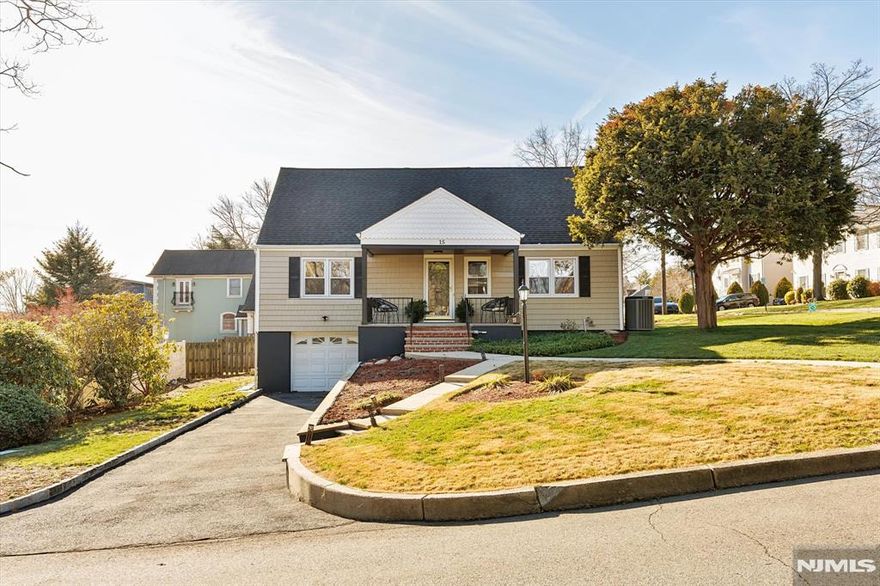 Location, Location, Location! This beautiful, move-in ready four-bedroom Cape is situated on a corner lot in the highly desirable town of Clifton, right on the Nutley border. Commuters will love the convenience, with easy access to Route 3, the Garden State Parkway, and NYC buses and trains. The main level features two bedrooms, a spacious living room with a wood-burning fireplace, a formal dining room, and an updated eat-in kitchen with a center island, new laminate floors, tile backsplash, and stainless steel appliances. A renovated full bath and access to the backyard complete this level. Upstairs, find two more good-sized bedrooms and another renovated full bath. The full finished basement extends your living space with a large family room, dry bar, wine cellar, laundry room, and storage/utility space, all with beautiful epoxy floors. Enjoy hardwood floors, recessed lighting, newer HVAC, and a private backyard perfect for gatherings. A one-car garage and parking for three additional cars in the driveway ensure convenience. All appliances stay, including the basement fridge. Home has been professionally staged.