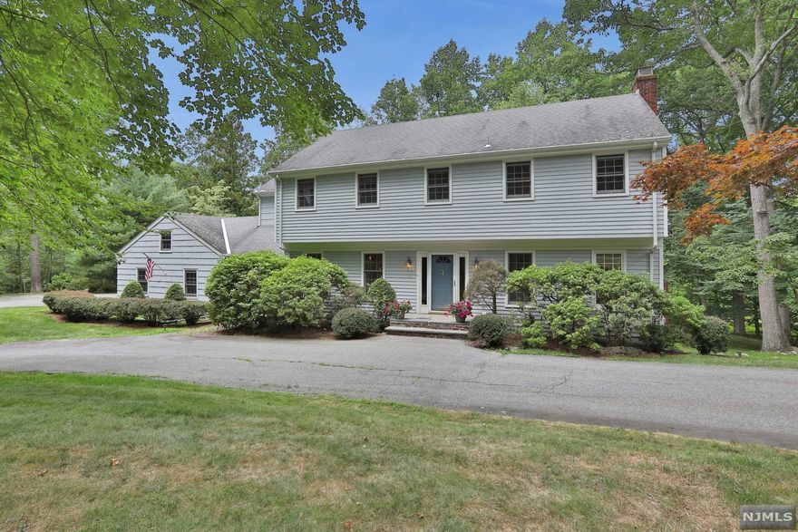 Location, Location, Location! This oversized colonial is nestled on a cul-de-sac deep in the stunning gated community of Smoke Rise for absolute privacy while still being able to enjoy all the amenities and benefits of the community. The first floor features beautiful parquet hardwood floors throughout the living room and dining room, and large windows let in tons of natural light. Sliding doors in the family room and living room open onto a large deck overlooking the yard. Upstairs are 4 bedrooms, including a large primary suite that includes a sitting area and full bath. In the walkout basement is another bedroom with private ensuite, bonus room, and den that can easily be converted to a full in law suite. Smoke Rise offers first-class amenities including use of the lake, clubhouse, tennis courts, and more!