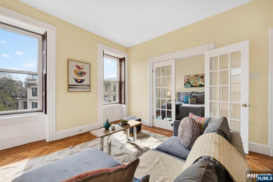 Perfectly situated on one of Hobokenâ€™s most desirable tree-lined streets, this corner one-bedroom residence offers an exceptional setting directly across from Elysian Park, with open green vistas and partial views of the Manhattan skyline. The home is defined by high ceilings and an abundance of natural light, with its corner positioning enhancing the sense of openness throughout. Original hardwood floors bring warmth and character, while the thoughtfully proportioned layout provides both comfort and functionality. Additional conveniences include an in-unit washer and dryer, as well as a rare deeded storage unit of approximately 60 Sqft located on the same floor. The HOA includes heat and hot water, adding further value and ease of living. Ideally located just a few blocks from the ferry and moments from PATH access to Manhattan, the residence also enjoys close proximity to the waterfront, as well as Hobokenâ€™s vibrant selection of dining and neighborhood amenities. This home presents a balanced offering of location, livability, and classic charm.