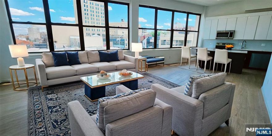 Welcome home to this large sized 2 bedroom apartment in the heart of Passaic. This beautiful unit boasts tall ceilings and gorgeous finishes throughout along with massive east facing windows for natural sunlight all through the day. The open concept kitchen is equipped with top-of-the-line appliances, ample counter space, an island, and plenty of closets for your storage needs. It is also outfitted with 2 gorgeous custom bathrooms as well. To top it off, there's a bonus room that can be used as a den, office, or walk-in closet. It is ideally located near all shops, restaurants, schools, and transportation. This is what you've been looking for. Call and schedule a private tour today!