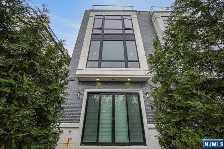 Stunning "like brand new" 4-story state of the art townhouse overlooking the Hudson River, George Washington Bridge, and NYC skyline. This 5800 square-foot brick, Masonry townhouse features four bedrooms, three full baths and 2 half baths. (Each bedroom has its own bath). The main level has a magnificent open floor plan with living room w/ FPL, dining room, and gourmet kitchen w/ quartz counters. There is LED lighting throughout and built in speakers with surround Sound. Motorized blinds allow the sunlight to shine through. The master bedroom suite has stunning views of the skyline, walk in closet and an amazing Master bath. The 4th floor "sky room" has a wet bar, 1/2 bth, and a great rooftop deck with spectacular views. This unit has state of the art security system with cameras throughout. All televisions and monitors included with rental. The elevator goes to every floor.