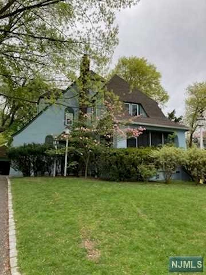 Home Sweet Home! Charming Tudor style. HW throughout 1st and 2nd floors.