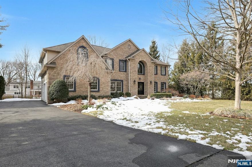 This is the home you have been waiting for! Set in the highly sought after Knolls neighborhood, this stately colonial home is set up for todayâ€™s living. Complete with a newly constructed premium outdoor kitchen/covered patio, this is truly an entertainers dream. The covered bluestone patio is complete with a built-in grill, fridge, speakers, heaters, tv and a separate gas firepit area! Enjoy the spacious living area inside the home complete with high ceilings on the first floor, open plan, updated kitchen, breakfast area, great room w/gas fireplace and custom built ins, formal dining room and living room and 2 story entry foyer. Upstairs comes complete with a sumptuous master retreat, 3 additional bedrooms, 2 full baths and laundry. The basement consists of high ceilings, a gym, living room, game area and powder room w/stair access to the garage. Look no further â€“ this is the one!