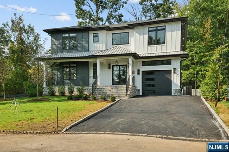 New construction with 10 year builder warranty. Contemporary Colonial on a dead end street in a premiere section of Livingston. Sleek and Spacious!! Sunlight in every room!! This home has everything. 6BR/5BA and extra rooms for your home office. The chef's kitchen boasts Z-Line commercial appliances and a quartz prep island that seats 4. Double oven has 6 burners, a griddle, a pot filler, and a commercial vent to the outside. The adjacent family/dining room has an oversized electric fireplace and easy access to the rear yard and trex deck. With 39 cabinets and drawers, the kitchen has ample storage to keep the counters clear. The open floor plan has sightlines to the Dining room with a wet bar and closet storage for holiday dishes. The second floor has 4 bedrooms, 3 baths and large laundry room. The primary en-suite has a large dressing room and a walk-in closet. The primary bath has radiant floors, dual marble vanity, large shower stall, soaking tub.