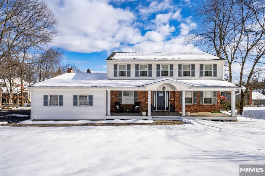UPDATED CENTER HALL COLONIAL IN DESIRABLE LOCATION. Numerous recent upgrades throughout. Features include a newer roof, updated kitchen, newer heating and central air systems, and a new deck ideal for outdoor entertaining. Upgraded electric service, hardwood floors throughout the living room, dining room, family room, and bedrooms. Family room with fireplace, Spacious eat-in kitchen with glass doors to the deck. Well-maintained home with many improvements over the years.