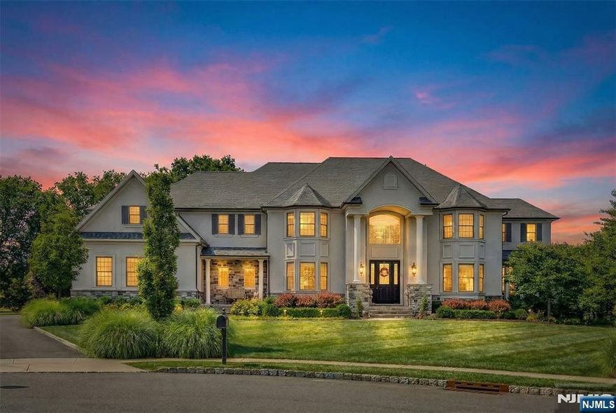 Nestled in Denville's most exclusive enclave, this exceptional home of distinction sits on the flagship lot in a private community of just 26 premier residences. Perfectly positioned in a serene cul-de-sac, this golf course property spans 1.22 acres with 430+ feet of frontage on Rockaway River Country Club, offering unmatched privacy and expansive green views rarely offered in a suburban setting, defining true elevated living and exclusivity. With 5,900+ sq ft, this custom home features a grand 2-story foyer, coffered ceilings, distinctive entryways, and refined millwork. The custom-designed chef's kitchen with built-in dining area and Taj Mahal quartzite flows into a sunroom and expansive family room, ideal for open-concept living. Five bedrooms with en-suite baths include a first-floor in-law suite. The primary suite offers a sitting room and double-sided fireplace, walk-in custom closets, and spa-like bath with heated floor. The private setting is perfect for a pool, while the basement can showcase a home theater, great room, or bar. Located in sought-after Denville, known for top-rated schools, vibrant downtown charm, and ideal NYC or commuter access with mass transit, nearby EWR, or private airports. Enjoy nearby county park with 550+ acres of woods and trails, plus Hallmark-style downtown with dining, shopping, and community events. A rare opportunity to acquire a luxury estate with a unique blend of upscale suburban living and small-town charm. Visit 8philhowerct . com