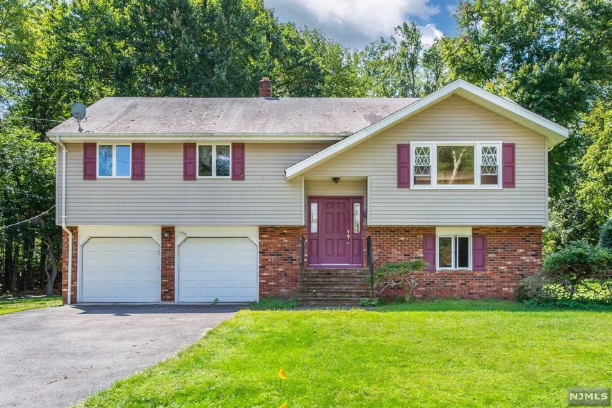 Welcome to this 3 bed 2.5 bath home with over 1900 sqft of living space in the heart of the sought after town of Ramsey! Sitting on a corner lot with over 0.353AC of land on a quiet, tree-lined street with a family friendly neighborhood. Home features hardwood flooring throughout, with 1st floor eat-in kitchen and sliding doors leading to private deck, dining area, living room, hallway full bathroom, master bedroom with walk-in closet and master bathroom. Ground floor features a large family room, laundry room, garage door entry, closet space, half bath, and sliding door leading to a massive yard. If you are looking for your chance to live in Ramsey, this is it. Property will not last, submit your offer today! Seller prefers to sell home AS IS.