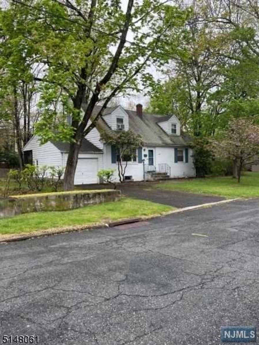 A true'Diamond in the Rough' situated in one of the most desirable areas of West Caldwell on a cul de sac, this 3 bedroom (potential for 4th) has two full baths and a full 'high ceiling' basement. Hardwood floors throughout first level with access to covered 11x10 porch overlooking level spacious rear yard. Wonderful location, gas heat, city water/sewers. Ready for your personal touches and upgrades to make it perfect! Home including fireplace is being sold 'as is' although any issues are unknown. An amazing community, schools, shopping, restaurants, near major highways and transit.