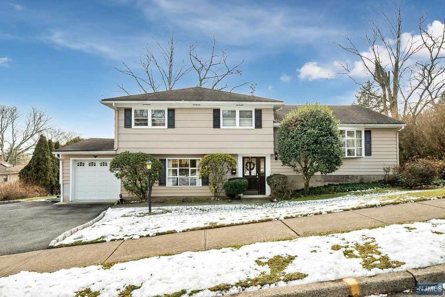 Home Sweet Home! Tucked away on a tree-lined street is a charming 3 BRM, 1 full, 1 half bath Split-Level. This home offers a level park-like lot, with a backyard that's ideal & suitable for a future in ground pool. It's just minutes away from the 2018 National BLUE-RIBBON GRAMMER SCHOOL, James Fallon making this home a perfect choice. As you enter the foyer, there is a huge family room and half bathroom to the left and door leading to the backyard and one to the garage. A few steps up to the first floor is a large living room, dining room and kitchen. The second floor offers three bedrooms and a full bath. There are hardwood floors under the carpet on both the first and second floors. There is also a large unfinished basement, gas hot air heat and central air. This home is being sold in as is condition so bring your vision & unearth this home's true potential. Wayne Township defines, the meaning of COMMUNITY.