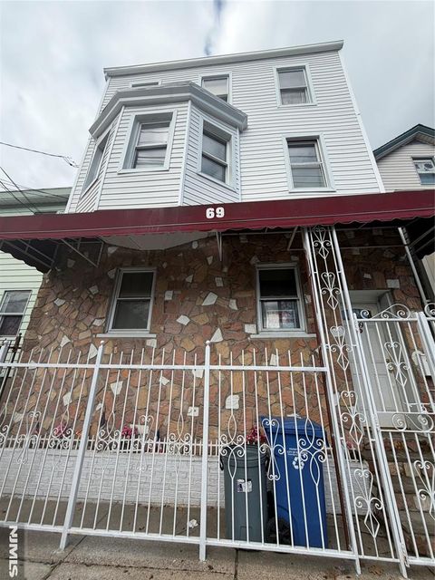Photo of 65 Grand St, Paterson, NJ 07501 (MLS # 26008353)