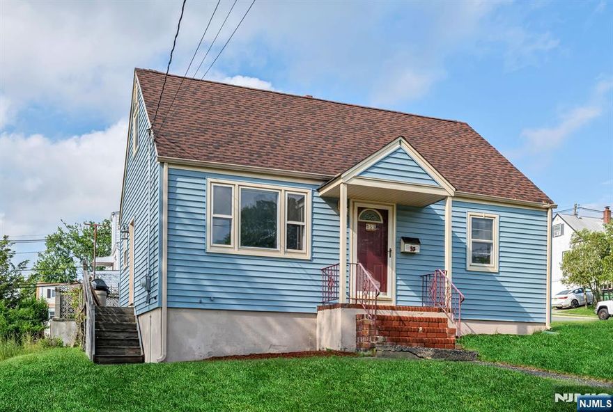 Bring your Contractor! Home is being sold AS IS. Charming Cape Cod on oversized lot in Woodland Park. This two bedroom (convertible to three), one bathroom cape is the perfect starter home and is steps to two public schools - Charles Olbon School (K-3) and the Early Learning Center (Pre-K), two nearby parks, and the Morris Canal pathway. The living room offers a large picture window that sees a lot of light and is open to the dining room, which easily fits a table for eight. The eat-in-kitchen has access to the large wood deck with fantastic views of the Watchung Mountains and absolutely beautiful sunsets. The first floor bedroom is currently being used as a home office. The second floor offers the primary bedroom and attic space. The unfinished basement offers great potential to create a wonderful family room or playroom. The home is being sold as-is, with a set of architectural plans that show the potential for a 6 bedroom, 4.1 bath home, including an in-law suite, that can be built on this property, no variances necessary. Woodland Park is a wonderful community offering easy access to all major Northern NJ highways and NYC Transit.