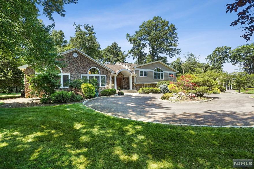 This 4 bedroom/ 3.1 bath situated on close to an acre of professionally landscaped property, provides the perfect combination of architectural elements and imported finishes to create a feel of a global lifestyle. A thoughtful floor plan, soaring high ceilings, gorgeous expansive windows, handcrafted millwork and the finest wood and stone finishes are only a sample of the painstaking efforts put into the renovation of this home. Family room with coffered 12-foot ceiling, huge gourmet kitchen, sunroom with access to deck, large den with sliders to stone patio and a gorgeous primary bedroom suite with onyx and marble bath and instagram worthy closets make this very special home a must see!