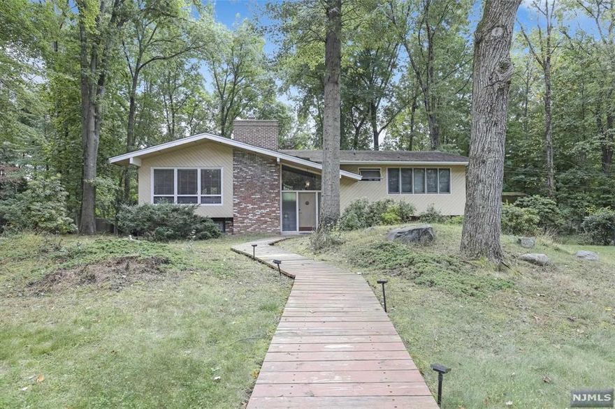 Charming 3-Bedroom Home in Old Tappan. Nestled on a quiet, peaceful cul-de-sac, This expanded bi-level offers the perfect blend of elegance, comfort, and functionality. This stunning 3-bedroom home is thoughtfully designed for family living and entertaining. As you enter, you are greeted by a bright and spacious living room, ideal for relaxation or hosting guests. Adjacent to the living room is the formal dining room, perfect for family gatherings and dinner parties. The custom chef's kitchen boasts high-end appliances, ample counter space and granite countertops. The homes large family room features vaulted ceilings and skylights creating an open and airy space flooded with natural light. Beautiful hardwood floors add warmth and sophistication. The finished basement offers additional living space that can be used for recreation, home office, or gym. Located on a serene cul de sac, and close to top rated schools. House is being sold "AS IS" BEST AND FINAL OFFERS DUE 12/17 5:00PM