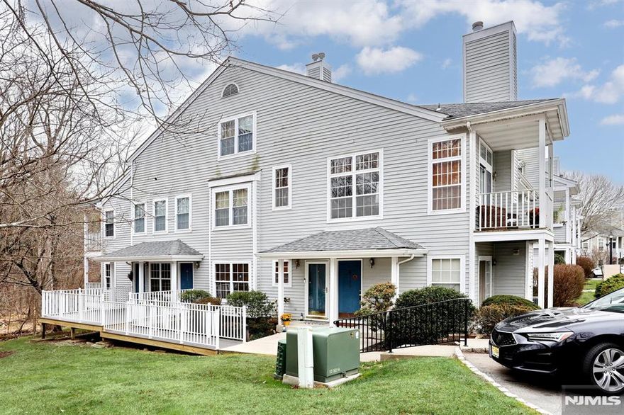 Welcome home! Freshly painted and move-in ready, this 2 Bedroom, 2 Bath townhouse condo offers a peaceful wooded view right from your living room. The open floor plan features soaring vaulted ceilings, a cozy fireplace, custom wood blinds, and sliding doors to your private balcony. A bright kitchen, large bedroom with sitting area and walk-in closet, full bath, and laundry complete the first floor, while upstairs you will find a spacious primary suite with full bath, and walk-in closet. Enjoy the perks of Paddington Square with a clubhouse, playground, and seasonal pool, plus your own reserved parking spot (#270). Located in Mahwah, you will love the top-rated schools, welcoming community, and easy NYC commute via Coach bus or NJ Transit train. A one-year Americas Preferred Home Warranty is included. This one will not last!