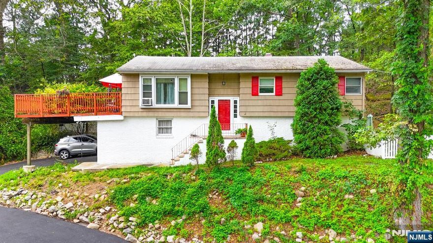 For more information on this home please contact Tommy Kindergan- 201-417-1310 Welcome to this spacious 2,048 sq ft home filled with warmth and comfort. Enter the inviting foyer that leads to a sunlit living and dining room with hardwood floors and access to an oversized deck overlooking a peaceful backyard. The large eat-in kitchen features walls of cabinets and a cozy breakfast nook. Two generously sized bedrooms and a full bath offer comfort and space. The primary suite includes a walk-in closet, private bath, and access to a screened-in three-season room. The ground level has a large family room with a wood stove, laundry, utility room, full bath, and patio access. Optional Skyline Lake membership available.