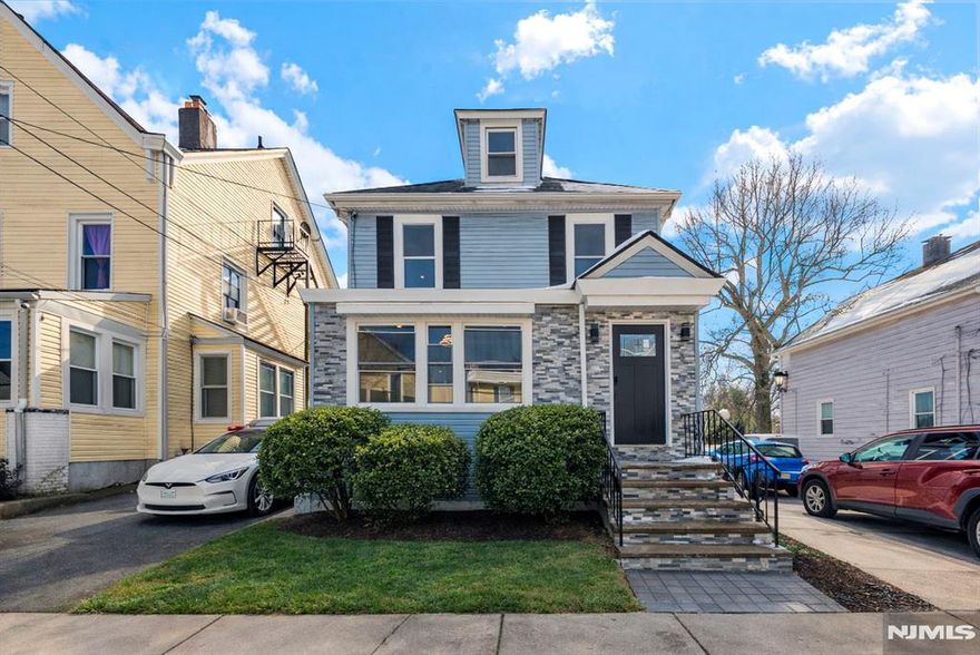 Welcome to 19 Highland Place in Ridgefield Park, a beautifully renovated colonial home that seamlessly blends modern sophistication with timeless charm. Filled with natural light, this home offers a bright, open layout and a warm, inviting atmosphere throughout. The first floor is designed for both everyday living and effortless entertaining, featuring a gracious living room, dining room, stunning redesigned kitchen, mudroom, foyer, and full bath. At the heart of the home, the kitchen impresses with a spacious island, sleek quartz countertops, premium stainless steel appliances, and a clean, contemporary design. Upstairs, the serene primary suite offers a private bath and peaceful retreat, complemented by two generously sized bedrooms ideal for a growing household or home office. The lower level, with direct backyard access, adds versatility with a half bath and dedicated laundry area. Just minutes from New York City, schools, shopping, and houses of worship, this move-in-ready home offers the perfect balance of suburban comfort and urban convenience. This could be yours.