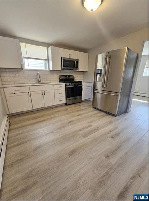 Photo of 15 Dell Glen Ave #1, Lodi, NJ 07644 (MLS # 26021058)