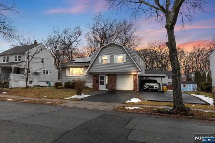 This superb-condition Sugar Maple Split Smart home in Teaneck offers the perfect blend of comfort, functionality and suburban charm. With an open floor plan, light and bright Living Room open to the Dining Room, open to the quartz-countered, designer kitchen with new stainless appliances, there's nothing you have to do. It's done! The 2nd level features 3 comfortable bedrooms, and a Dual entry, updated, full bathroom. The ground floor Family Room is being used as Formal Dining Room, with sliding doors leading to a paver patio. This floor also features a beautiful shower stall bathroom. The lower level has a newly finished Game Room basement/office. Laundry and Furnace utility Room. Updated HVAC & h/w tank. Updated, electric service. New Windows. Solar panels. Water Filtration system. Custom window treatments. Attached garage, carport/5 car parking. Huge property. Smart house: thermostats, wifi, etc. It's close to NYC buses, parks and schools, making it the perfect place to live.