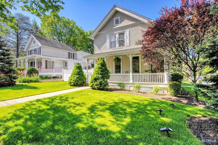 Magnificent Colonial with picturesque wraparound lemonade front porch in the heart of Closter! Beautiful new hardwood floors, custom molding and high ceilings throughout! Large and bright living room is open to the dining room and sitting area. Gourmet eat-in kitchen including granite countertops, custom tile, custom wood cabinets, peninsular/breakfast bar and stainless steel appliances. Updated full bath and laundry complete first level. The Second level offers three large bedrooms and an updated full bath. Lush, professionally landscaped property with fenced-in yard including large paver patio--perfect for entertaining. 2-car detached garage and paver driveway. Close to schools, parks and an amazing town that has so much to offer! You will absolutely love living here!