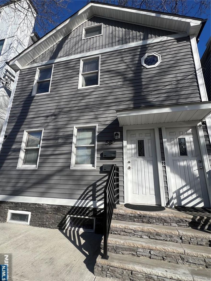 Welcome home to this completely renovated apartment in the heart of the Ironbound. This bright and spacious unit features three bedrooms and one full bathroom, an open-concept layout, and beautiful hardwood floors throughout. Enjoy your own private deck, perfect for relaxing or entertaining during the summer. Central air and heat provide year-round comfort. Commuters will love the convenience of being just two blocks from the New York City bus and only five minutes from Penn Station. Surrounded by popular restaurants, shops, and everyday conveniences. Don't miss the opportunity to live in a vibrant neighborhood and a great location.