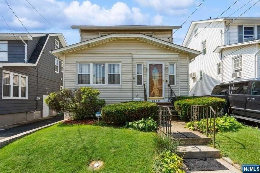 Classic, Cozy Charm in a Unbeateable Location! Well maintained 1930s side hall Colonial in the heart of Union mere blocks away from endless shopping, dining options on Morris Avenue & easy access to the Parkway, Rt. 22, I-78 & public transit for effortless commutes. This home boasts many old-world details and character, including hardwood floors, crown molding, rich trim + baseboards & more. The main floor begins with an inviting living room anchored by a brick wood-burning fireplace & flanked by a sitting/tv room & dining room with lots of space. Just beyond is a kitchen equipped w/tile flooring SS appliances & an adjacent full bath w/shower. All bedrooms are upstairs, along w/a full hall bathroom. Bonus finished space in the walk-up attic can be used as a playroom or office. Basement offers a large, bright finished rec-room, a 3rd full bath w/laundry, separate side entrance & utilities. A covered deck, fully fenced backyard and 1 detached car garage complete this lovely home.