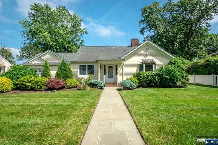 Welcome to this spacious and beautiful maintained 4 bedroom, 3 1/2 bath ranch, ideally situated on one of Ridgewood's most picturesque, treelined blocks. This home offers the perfect blend of comfort and convenience with generous living spaces, a functional layout, and room for extended family or guests. The main level is bright and spacious, perfect for both everyday living and entertaining. A large living room/dining room flows into the open-concept kitchen, which features direct access to the deck overlooking a well maintained lawn. The first floor primary suite boasts a walk in closet and a full bath. Off the kitchen, a versatile den or office adds flexible space for work or relaxation. A mudroom with laundry area (washer and dryer included) connects to the attached garage, completing the main level. Upstairs, you'll find two oversized bedrooms connected by a Jack and Jill bathroom. The newly finished basement offers exceptional bonus space, including 2 large living areas, a legal bedroom, full bath, and separate office-ideal for guests, work-from-home or recreation. This home is loaded with upgrades: Ring doorbell and six ring security cameras, reverse osmosis drinking water system, Tesla charger, standby generator, sprinkler system fully fenced yard. Enjoy the charm of suburban living with nearby parks, schools, and vibrant downtown Ridgewood. A rare find in a sought-after location!