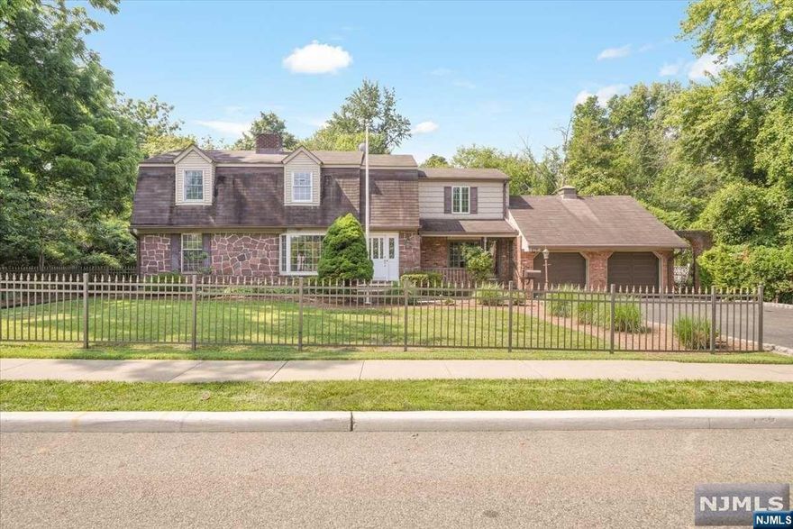 First time on the market in over 60 years! Lovingly maintained and recently renovated, this beautiful Colonial boasts approximately 2,650 SF and sits on a private and flat lot. Entry foyer welcomes you to a formal LR/DR with a large picture window and floor to ceiling stone fireplace. Open to the kitchen and great room, this setup is ideal for entertaining. Impressive great room showcases cathedral ceilings, gas stove and three walls of windows. This room is bound to impress the most discerning buyer. Completing this level is a full bath, bedroom/office, and mudroom w/ washer/dryer, slop sink and access to the side yard. Ascend the stairs and discover a primary bedroom suite complete with double door closet and bath. Four bedrooms and a remodeled bath are also maintained here. The partial, but finished basement provides an opportunity for additional living space. An abundance of storage in both the unfinished basement and loft attic over 2 car garage...and so much more!