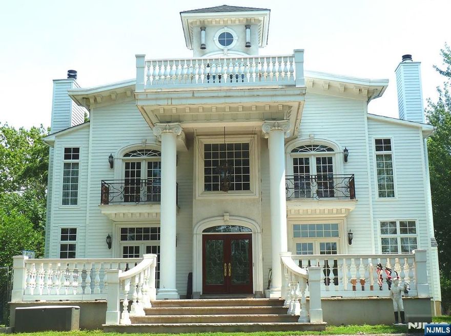 Luxury Riverfront colonial, on 2/3 acre of scenic private property. Indiana limestone floors and 20 ft columns. Grand Front Porch welcomes everyone. Living Rm with fireplace. Hand painted Venetian walls & Dining Room with fireplace. French Doors to the grand porch; great for gatherings. Entertaining Room with upholstered velvet wall. Wet bar with a wine refrigerator. Gourmet kitchen offers gorgeous marble flooring; Dacor, Subzero, Miele brand appliances. Wall coverings with hand painted paper from France and imported Italian marble counter-tops. Master Bedroom with fireplace. Upholstered wall coverings and French doors open to a balcony with an exquisite river view. Master Bath with lime stone artistic tile and hand painted mural provides fine finishing.