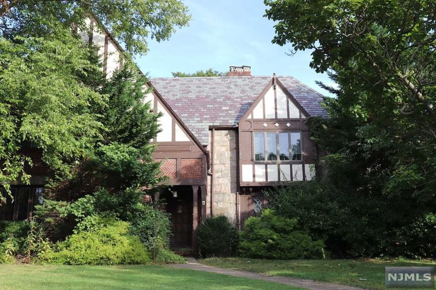 Wonderful opportunity with this Tudor style home located in the desirable Maple Hill Section. Property has lots of old world charm with formal dining room, eat in modern kitchen, banquet living room, spacious bedroom, study with fireplace. Exquisite craftship with wood finishes hard wood flooring, and moldings throughtout the entire home. With the right vision bring it back to its full luster. 2 car attached garage, long driveway for more off street parking, and is conveniently located close to schools, shopping, easy access to public transportation, with close commute to NYC. Come see it today and make it yours.