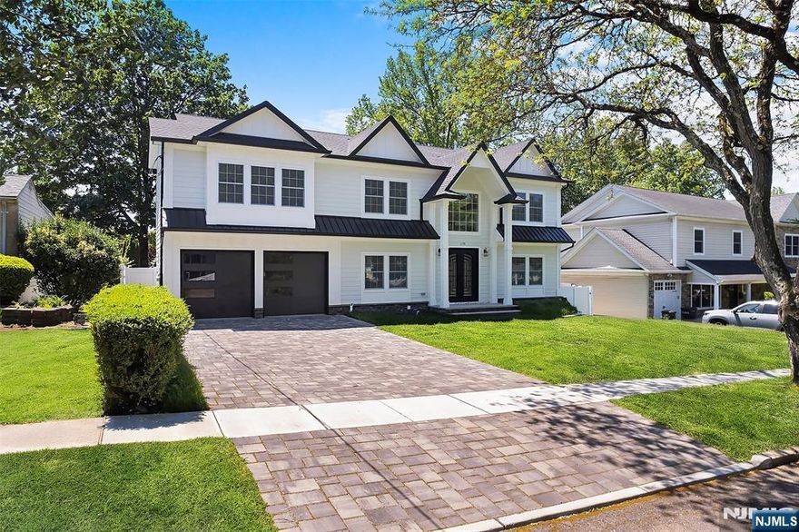 Welcome to an extraordinary new construction residence offering over 5,000 sq. ft. of luxury living in the heart of River Edge. Built on an existing foundation with a new foundation addition, this home blends modern design with timeless elegance. The main level showcases an expansive open layout with a gourmet Kitchen appointed with stainless steel appliances and a center island ideal for entertaining. A formal Dining Room, inviting Living Room, and a dramatic two-story Family Room with fireplace, soaring ceilings, and walls of glass create an unparalleled sense of space and light. A stylish Powder Room completes the first level. The second floor is highlighted by a serene Primary Suite featuring a fireplace, spa-inspired bath, and generous walk-in closets. Three Junior Suites, each with private full baths, provide comfort and privacy for family and guests. The finished lower level is designed for leisure and entertainment, offering a state-of-the-art Media Room, Half Bath, and flexible spaces to suit todayâ€™s lifestyle. Additional features include a central vacuum system and an attached two-car garage. Situated in desirable River Edge, this newly built home delivers the ultimate combination of luxury, location, and convenienceâ€”close to top-rated schools, shopping, parks, and NYC transportation. Owner holds NJ Real Estate License.