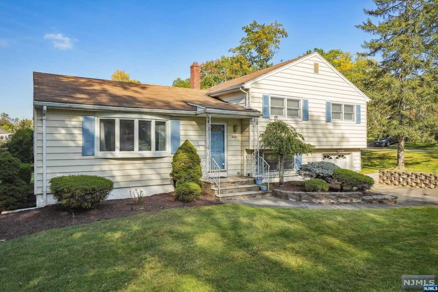 Opportunity knocks for this lovingly maintained south end split level set on a large level lot in a desirable neighborhood. The first floor offers a large living room, eat in kitchen with granite counters, DR and a sunroom. The second floor is comprised of the large main bath and 3 spacious bedrooms, including the primary suite with full bath and walk-in closet. Ground floor with a den, laundry room and garage access. The basement level rec room with bar and utility room offers tremendous possibility. Hardwood floors can be found throughout the first and second floors beneath the carpeting. Updated 200amp electrical panel, Andersen replacement windows and central air. Convenient to NYC transportation, which can be picked up at the corner. This special home offers an abundance of space bathed in natural light, in a super location. Not to be missed!